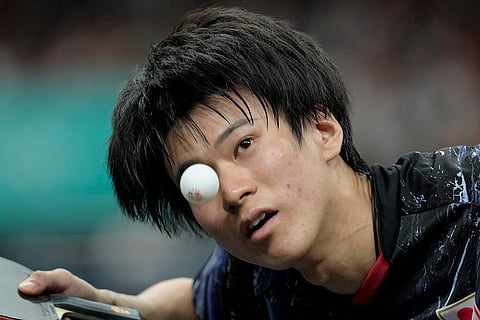 Japan's Shunsuke Togami plays against Slovenia's Deni Kozul